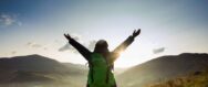 Greeting sun while long solo mountain trip