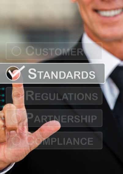 What-is-cpd-accreditation Business professional selecting Standards on a touchscreen menu alongside regulations, partnership and compliance